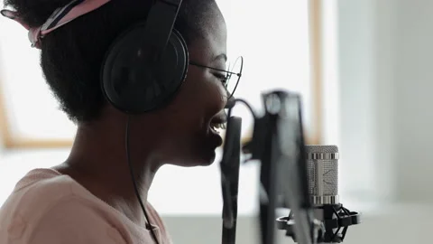 Podcast and audio content creation, confident and beautiful African-American Stock Footage 155253936