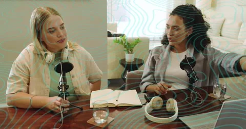 Podcast co-hosts tapping laptop record button at table and generating animated Stock Footage 320416278