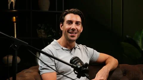 Podcast host broadcasting content in a modern studio Stock Photos