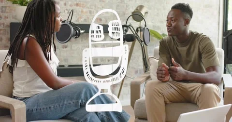 Podcast hosts shifting camera, widening view revealing boom mics, filming under Stock Footage 330716009