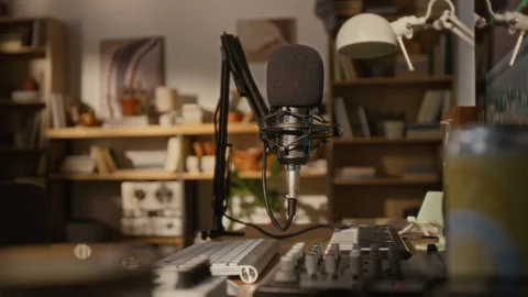 Podcast Microphone Standing on Desk in Creative Home Studio Stock Footage 337506742