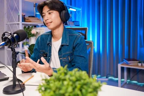 Podcaster explaining ideas during live session Stock Photos