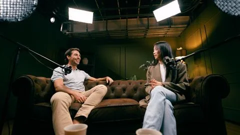 Podcasters creating engaging content for broadcasting interview Stock Photos