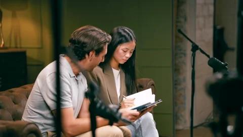Podcasters preparing for a show in a recording studio Stock Footage 343626004