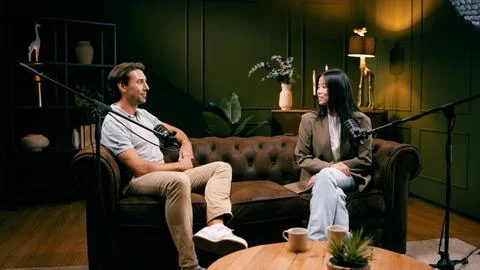 Podcasters recording interview in a modern studio Stock-Fotos