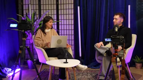 Podcasters recording a live streaming talk show interview Stock Footage 328633680