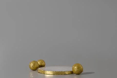 Podium with golden elements on the gray background. Podium for product, cosme Stockfoto's