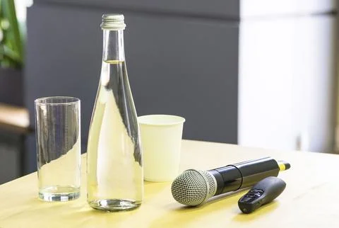 Podium for the speaker. Microphone, Laser pointer, water Bottle, Glass On t.. Stock Photos