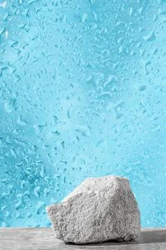 Podium texture stone for presentation on a blue dewy background. still life.. Stock Photos
