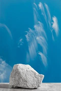 Podium texture stone for presentation on a blue sky background. still life for Stock Photos