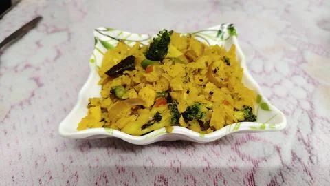 Poha topped with peanuts Stock Photos