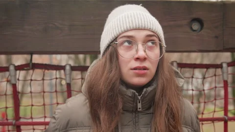 Poignant winter vignette. Expressive image of woman in winter with raw emotion Stock Footage 345552264