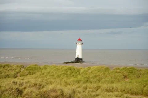 Point Of Ayr Lighthouse With Red Cap On Talacre Beach, North Wales. Stock Photos
