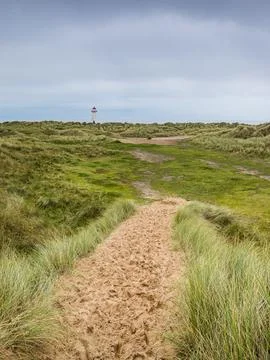 Point of Ayr Lighthouse seen over the sand dunes Stock Photos