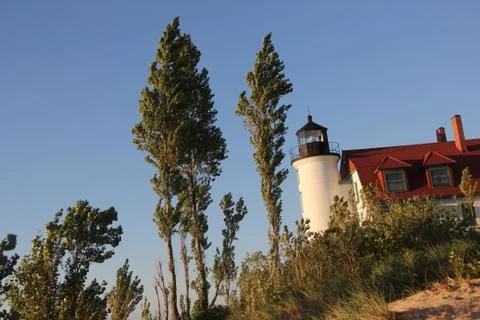 Point Betsie Lighthouse among the trees on the shore of Lake Michigan Stock Photos