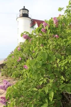 Point Betsie Lighthouse with Blooming Spring Lilacs – Lake Michigan Stock Photos