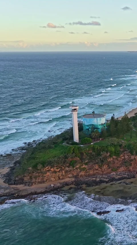 Point Cartwright Lighthouse and Mooloolah River aerial sunset panorama, Sun.. Video stock 334786287
