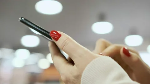 Point finger on mobile phone screen close up, woman sending text message, girl Stock-Footage 200803933
