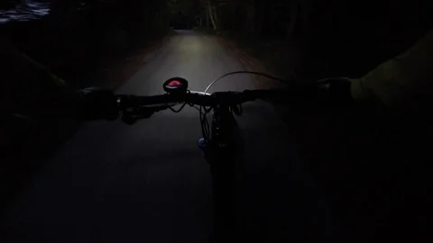 Point fo view: Mountain biker riding at night. Stock Footage 82324691