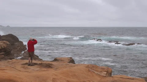 Point Lobos - Pacific Ocean Waves on Rocky Coastline with Photographer Stock Footage 66970291