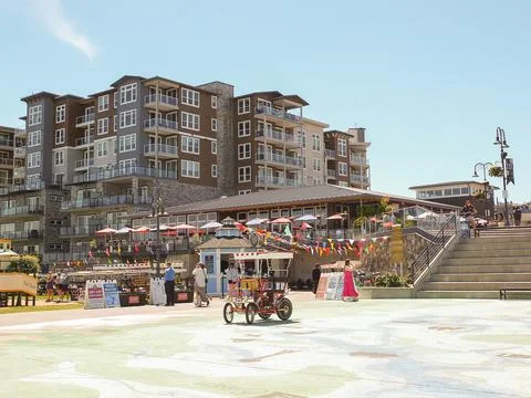 Point Ruston public plaza square with modern buildings, restaurants, and pe.. Stock Photos