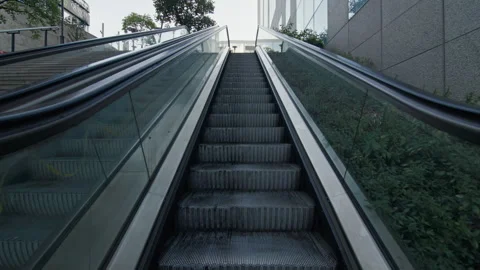 Point of U rises by escalator in the beautiful business district of the city. Stock Footage 313366041