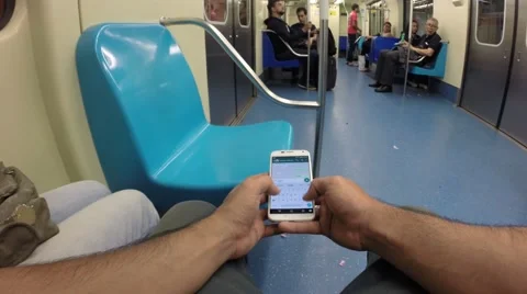 Point of view about a man typing a message in the train of sao paulo city 動画素材 57828902