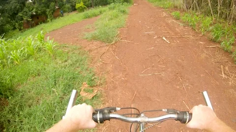 A point of view action shot looking down at a white mans hands on a handle Vidéo 118389972
