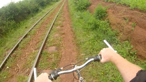 A point of view action shot looking down at a white mans hands on a handle Vidéo 118390053