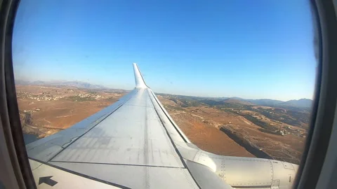 Point of view on airplane wing during flight Stock Footage 166231044