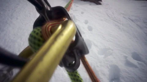 Point of view of belaying while climbing a snowy mountain Stock Footage 335099337