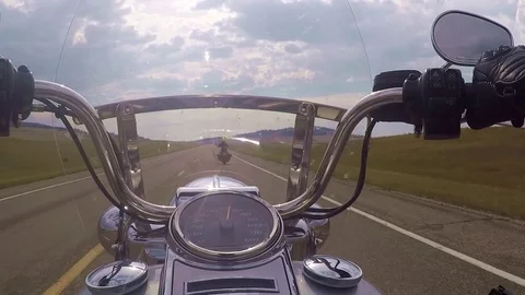 Point of view of a biker on his motorcycle, being past over my anther bike Stock Footage 83397911