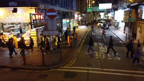 Point of view of a bus rushing through Kowloon, Hong Kong at night. Stock Footage 102813408