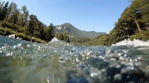 Point-of-view camera floating in the Skykomish River on a summer day. Stock Footage 99667646