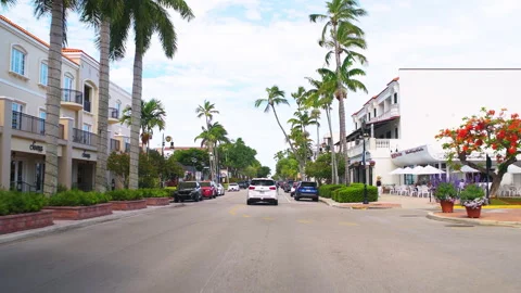 Point of view car driving at Florida Naples fifth 5th South avenue shopping mall Stock Footage 218273922