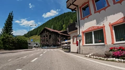 Point of view car driving on a mountain road in Dolomites Italy Alps Stock Footage 248389045