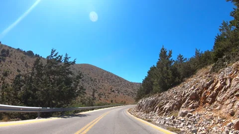 Point of view of car driving at road in scenic mountain environment. Auto ride Stock Footage 309100457