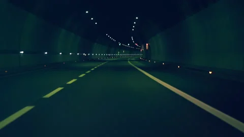 Point of view car driving tunnel at night Stock Footage 147999005