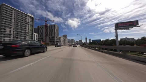 Point of view of car view driving plate on Miami highway during daytime Stock Footage 276654657