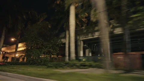 Point of view of car view driving plate on Miami city streets illuminated Stock Footage 276655165