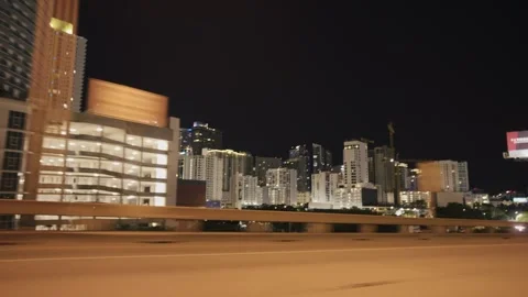 Point of view of car view driving plate on Miami highway illuminated at night Stock Footage 276655408
