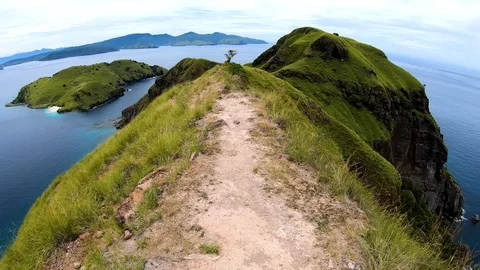 Point of view cliff top hiking trail Indonesia Stock Footage 112928079