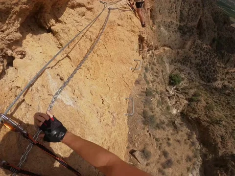 Point of view of a climber with his partner going through a section of a via Stock Footage 219887425