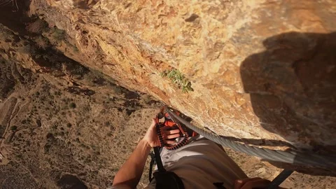 Point of view, climbing a section of via ferrata, changing sections with the Stock Footage 219887502