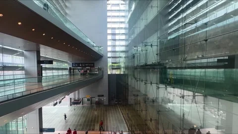 Point of view coming down the escalator at Changi Airport towards the MRT train Stock Footage 334667107