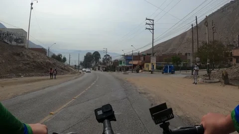 Point of view of a cyclist riding his bike down Cieneguilla avenue Vidéo 144278161