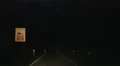 Point of view of driver traveling at night, driving rural road, traffic signs 4k or 4k+ Resolution