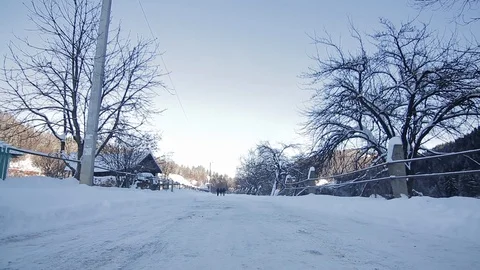 Point of view from drive's side, vehicle driving on snowy mountain road. Stock Footage 126243302