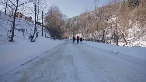 Point of view from drive's side, vehicle driving on snowy mountain road. 動画素材 126243521