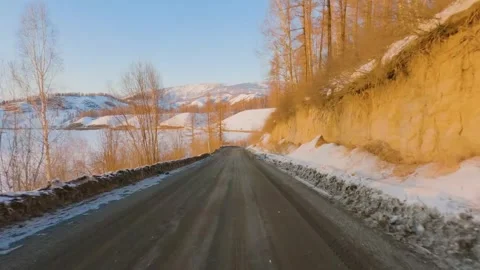 Point of view driving along mountain river road at sunset Stock Footage 346636285